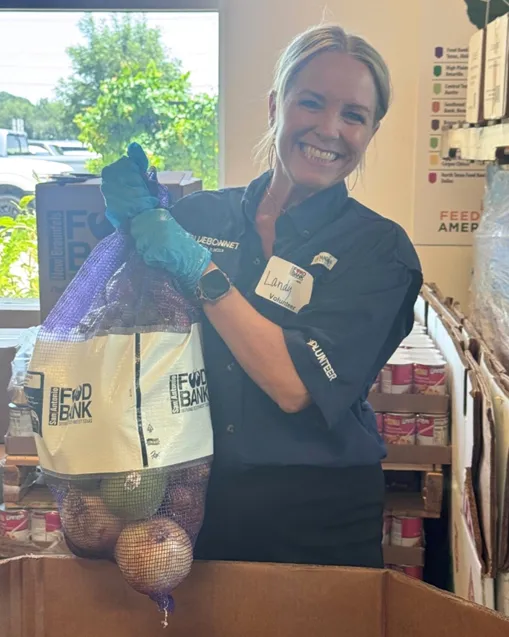 Smiling Bluebonnet Ford volunteer at New Braunfels Food Bank